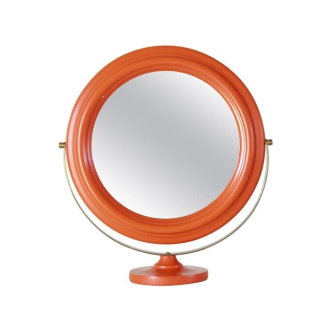 Vintage italian table mirror with orange wood and brass frame.